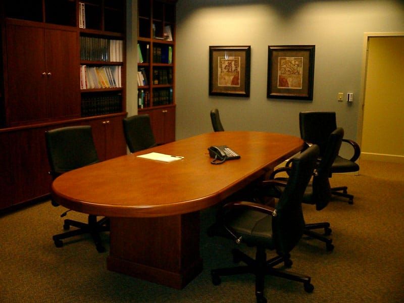 meeting room with oval table and six chairs