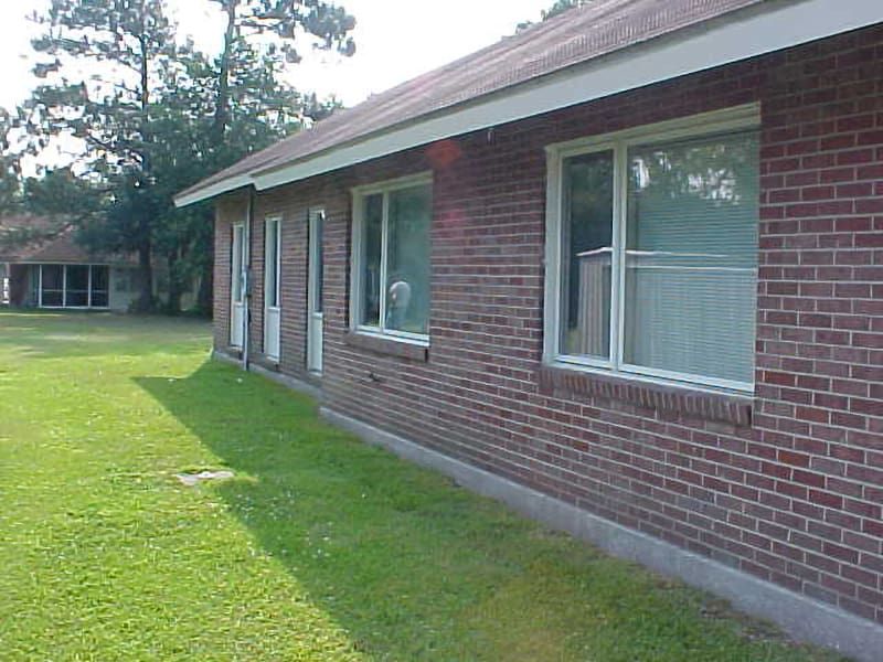 side windows of red brick house