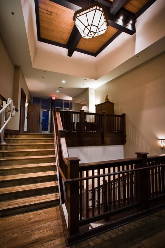 Interior stair case and modern overhead light feature