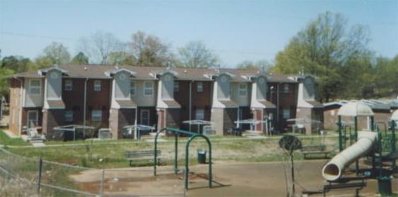 playground with two story homes in background