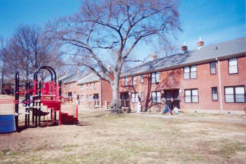 playground and two story brick homes