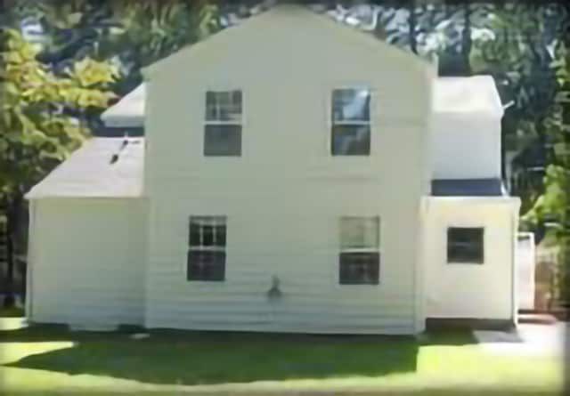 white house with five windows