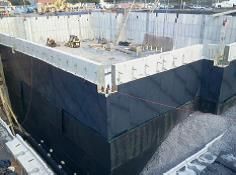 tarped building under construction