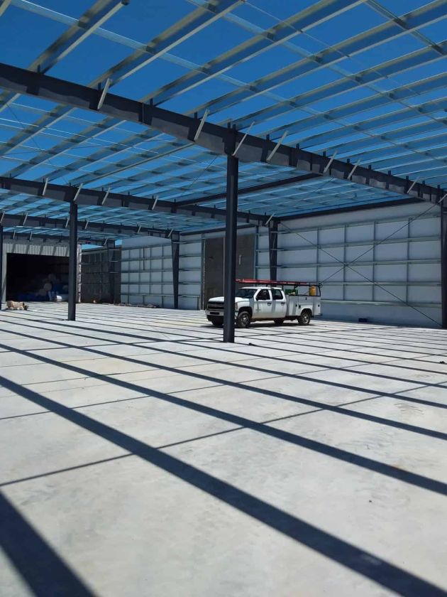 pickup truck in a partially constructed warehouse