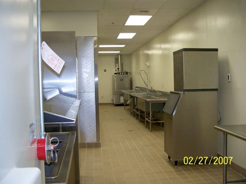 tiled room with stainless steel appliances