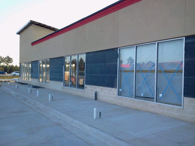 windows on side of mostly complete car wash building