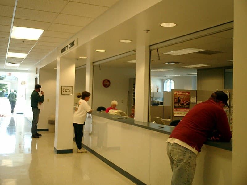 people at county clerk reception windows
