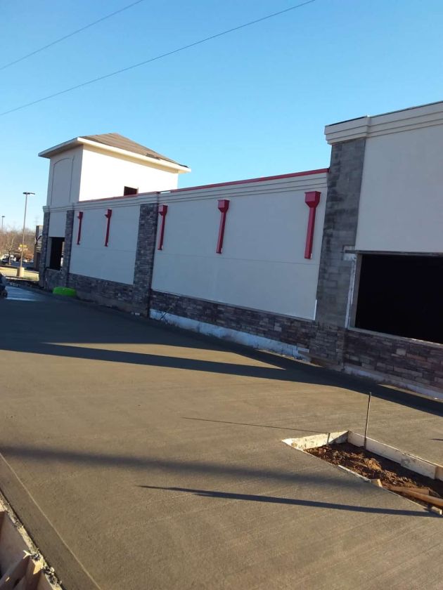 side of  nearly complete car wash building