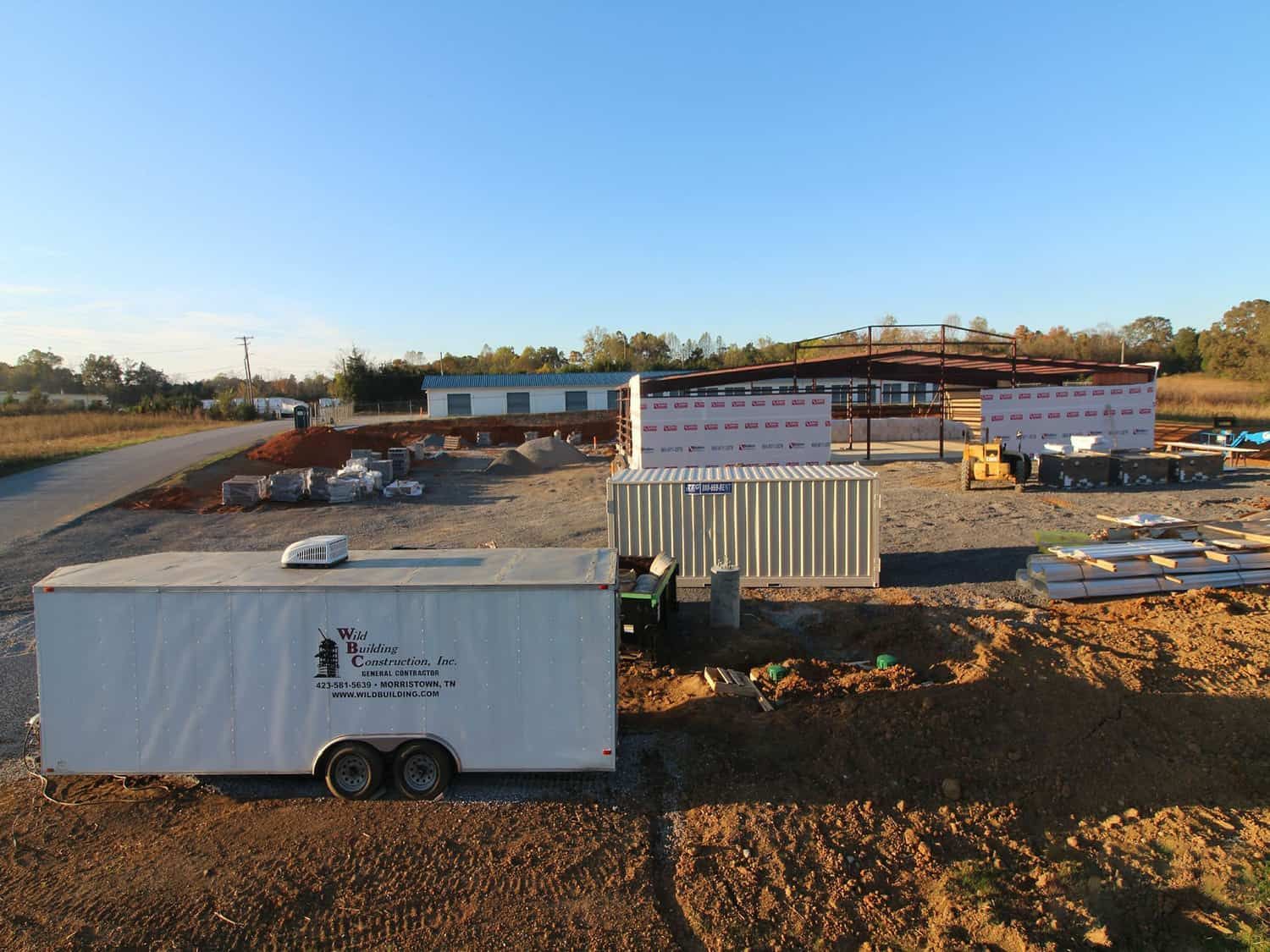 wild building trailer in front of retail building frame