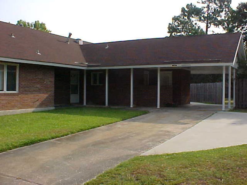 car bay of red brick house